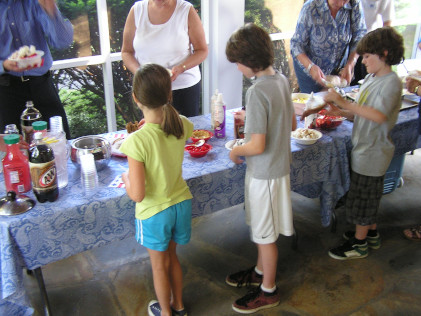 Children making ice cream sundaess